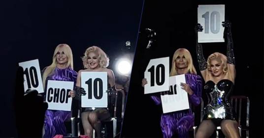 Concerto di Madonna a Milano: Donatella Versace sul palco sbaglia a tenere i cartelli e su X diventa un meme