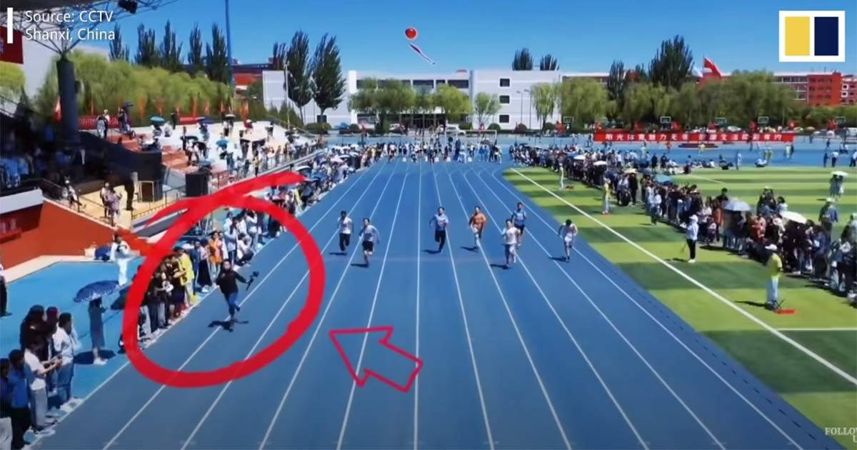 Il Cameraman corre più veloce dei concorrenti nella gara dei 100 metri: il video diventa virale